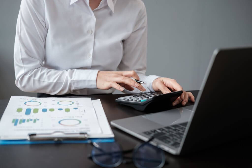 Cash Flow Management: Your Path to Financial Stability 1 an accountant calculating using his calculator